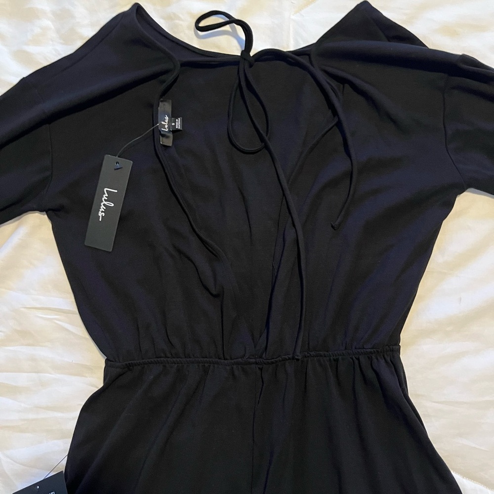 Lulu’s black bell sleeve open back with tie Romper